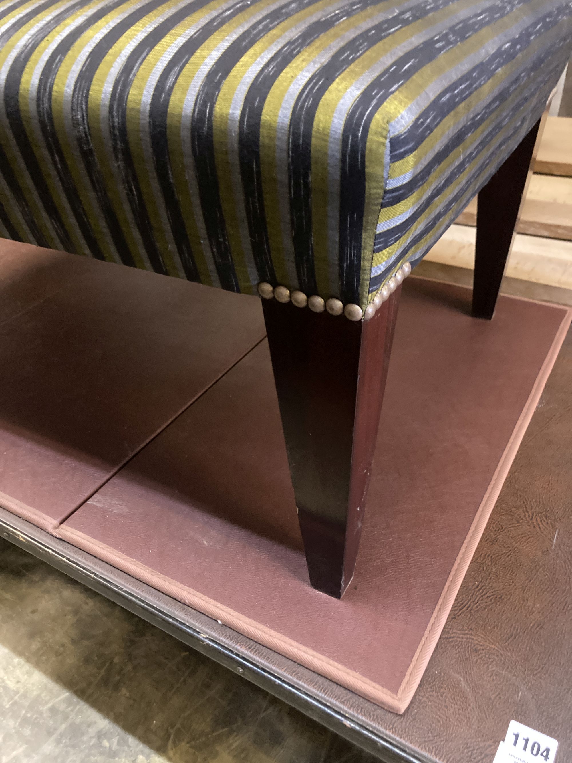 A modern rectangular footstool on square tapered legs, width 100cm, depth 56cm, height 38cm
